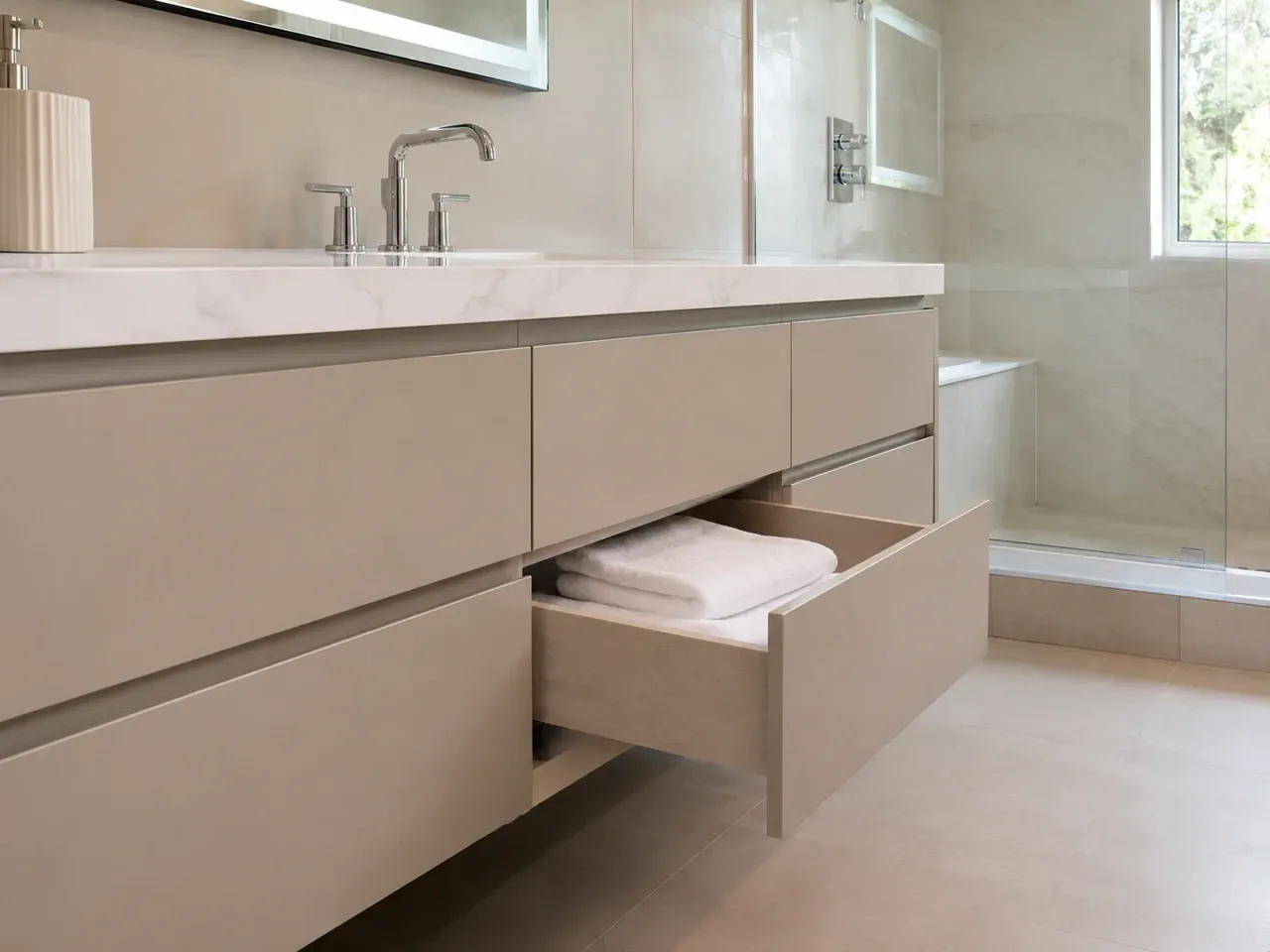 Soft-close bathroom vanity drawer with folded towels in a Sarasota, FL bathroom